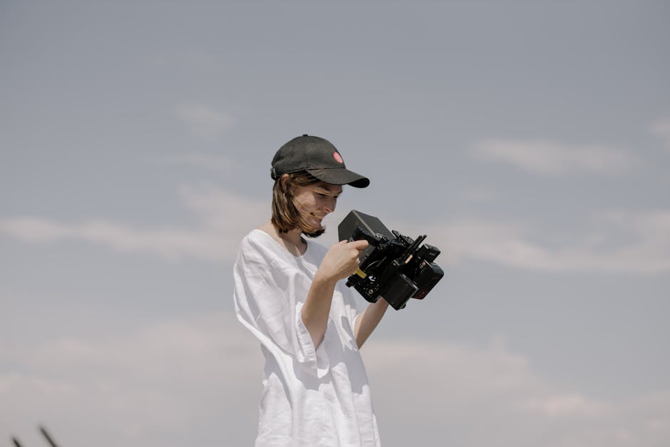 Wedding filmmaker working behind the scenes capturing a couple
